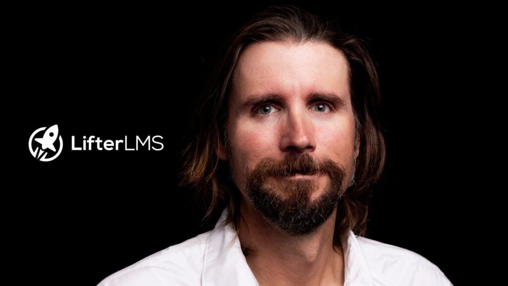 Man with long brown hair and a goatee wearing a white shirt against a black background next to the LifterLMS logo