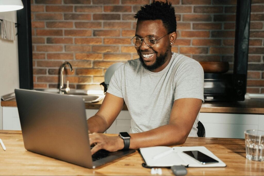 Man working on a continuing education course using a laptop at home.